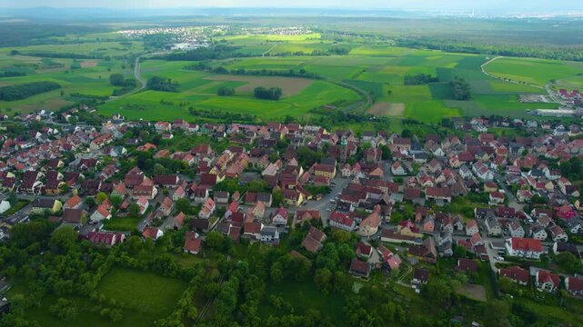 Aerial view of the city Kalchreuth in Germany, on a cloudy day in spring.