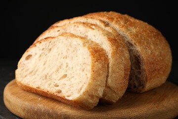 Fototapeta premium Pieces of fresh bread on table, closeup