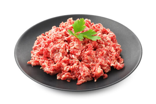 Raw minced beef and parsley isolated on white