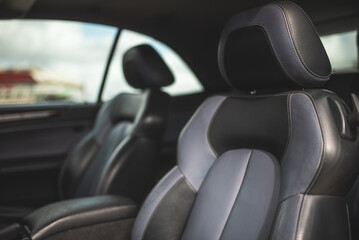 Obraz premium Luxurious car interior with comfortable leather seats and a modern design