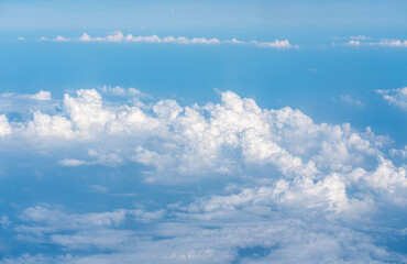 Fototapeta premium Blue Sky with White Clouds, Flying above Sunny Cloudy Sky Texture Pattern Plane View