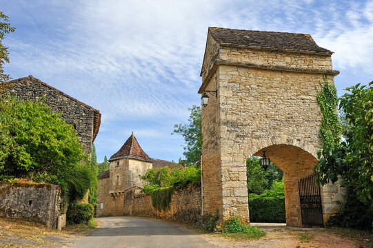 Historic architecture and pathways in the village of Lherm, Bouriane region of France during the day