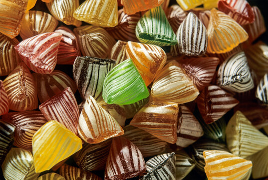 Homemade boiled sweets from Confiserie Clavel in Carpentras, France, showcase colorful shapes and distinct flavors, made with traditional methods