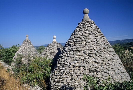 Exploration of dry stone huts known as Borie in the Provence region of France during a sunny day