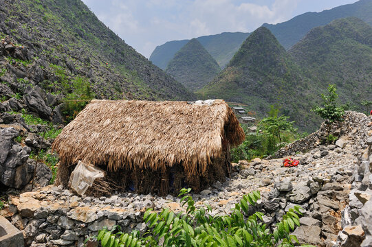 Mountain hamlet near Sa Phin in Dong Van plateau, Ha Giang province in Northern Vietnam surrounded by hills and rocky terrain