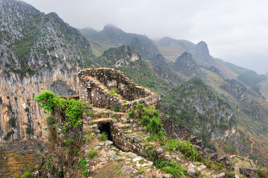 Ruins of colonial fortress on mountain ridge overlooking valleys in Northern Vietnam
