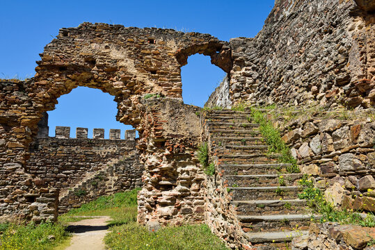 Exploring the ancient ruins of Mourao Castle in Alentejo region of Portugal during a clear day in southwestern Europe