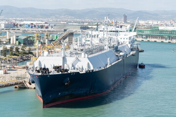 Naklejka premium LNG tanker at industrial port terminal. Barcelona, Spain