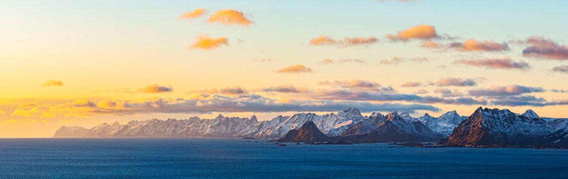 Sunset over Vestvagoy Island viewed from Henningsvaer in Lofoten Islands, Norway during winter
