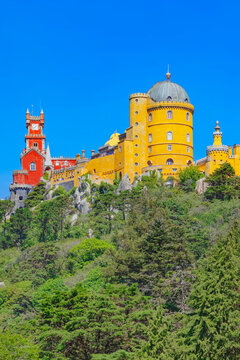 Exploring Pena Palace set against a clear blue sky in Sintra on a sunny day
