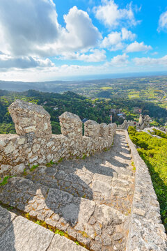 Exploring the walls and views from Castelo dos Mouros in Sintra, Portugal on a clear day