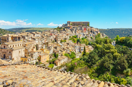 Elevated view showing the architecture and landscape of Ragusa Ibla in Sicily during a clear day with blue sky
