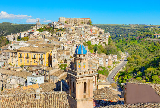 Elevated view showcases church of Santa Maria dellItria and Ragusa Ibla in Sicily Italy with surrounding hills and buildings