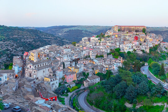 Elevated view of Ragusa Ibla showing buildings and landscape in Sicily Italy under evening sky