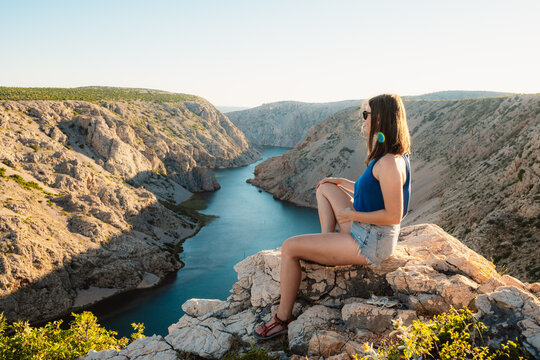 View of the Zrmanja River Canyon in Croatia, with winding turquoise waters cutting through limestone cliffs. A scenic natural wonder popular for kayaking and hiking