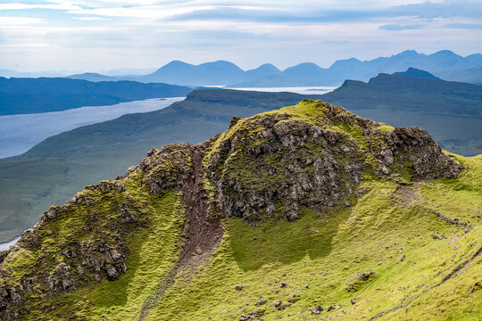 Explore the rugged hills and scenery of the Trotternish escarpment on the Isle of Skye in Scotland during a clear day