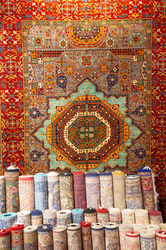 Carpets displayed for sale in a shop, showcasing designs and colors, attracting buyers in Antalya, Turkey