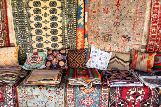 Carpets and pillows for sale in a market area of Kaleici Antalya Turkey during the daytime