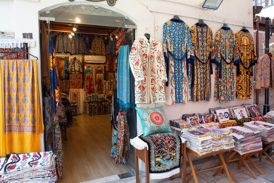 Textiles for sale in Kaleici area featuring colorful patterns and designs in Antalya, Turkey