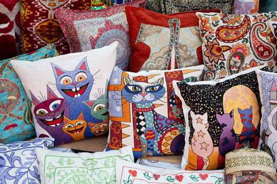Pillows for sale at Arasta Bazaar showcasing colorful designs and patterns in Istanbul, Turkey
