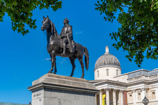 View of the equestrian statue of King George IV and National Gallery in Trafalgar Square during summer in London