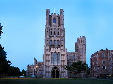 Ely Cathedral stands strong at dusk with its towers and walls in Ely Cambridgeshire