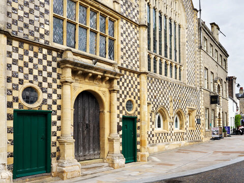 Guildhall building stands in Kings Lynn Norfolk showcasing historic architecture from a central street view during midday hours