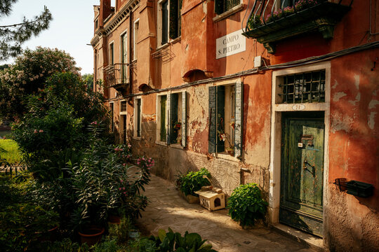 Discovering hidden corners of a quiet street in Venice's La Tana neighborhood in the afternoon light in Veneto, Italy