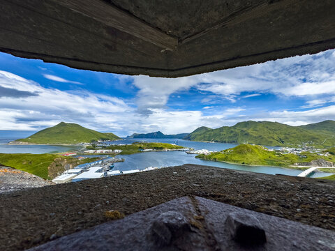 View from an unused World War II bunker in Dutch Harbor, Unalaska, Alaska with mountains and water below