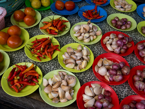 Vibrant offerings for sale in crowded market streets of Agats, Asmat Regency, South Papua, Indonesia during a bustling day