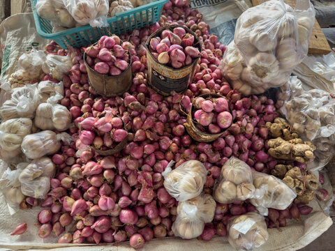 Market scene in Waingapu showing garlic and shallots for sale in East Sumba Regency, Indonesia