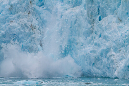 Views of glacier calving in snowstorm at Larsen Harbour in Drygalski Fjord on South Georgia Island in Southern Ocean