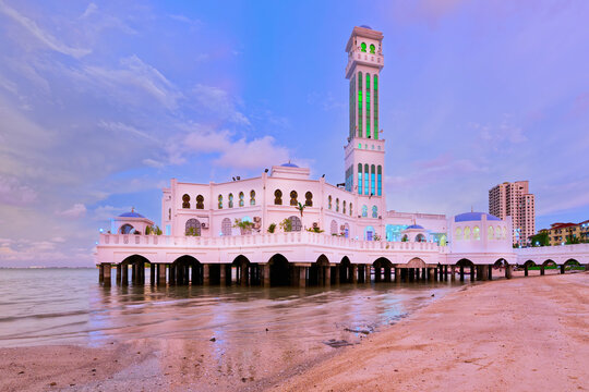Explore the beauty of Penang Floating Mosque at sunset along the shore in Malaysia