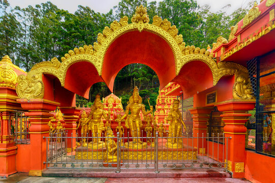 Golden statues at Sriramajayam Hindu Temple in Nuwara Sri Lanka showcase intricate designs and cultural significance in a vibrant setting