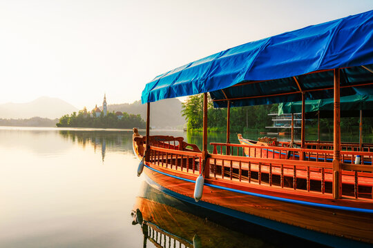 Boat on Bled, Slovenia. Bled Castle with Lake Bled with the Church of the Assumption of Maria