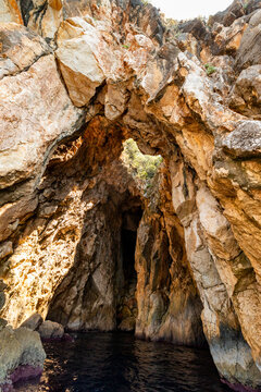 Rock arch and narrow sea cave entrance found in coastal cliffs of Ionian Sea near Dhermi in Vlor County, Albania
