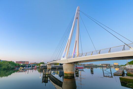 Footbridge connects Govan and Partick over the River Clyde in Glasgow during early evening