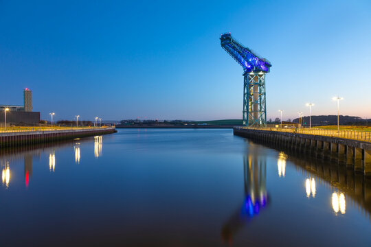 Clydebank Titan stands over River Clyde at twilight near Clydebank in Scotland