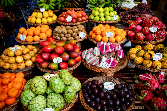 Vibrant tropical fruit market offers fresh fruits in baskets in Portugal
