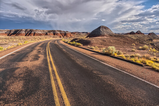 Road leads to Teepees and desert landscape at Petrified Forest National Park in Arizona
