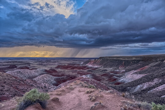 Storm approaches over the canyons at Petrified Forest National Park in Arizona viewed from Nizhoni Point