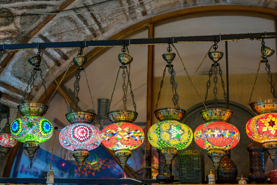 Colorful mosaic lamp chandeliers hanging in a bazaar market in Izmir, Turkey