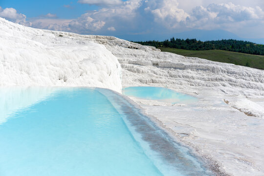 Calcium carbonate travertines with turquoise water in Pamukkale, Denizli, Turkey during clear sky