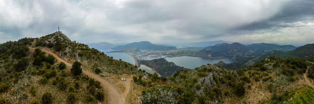 Panoramic view of camper vans at Dalyan turtle bay in Turkey on a cloudy day