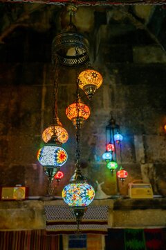 Colorful chandelier lights hang in a traditional Turkish room in Avanos Cappadocia