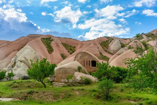 Exploring the rock formations and cave systems in Pidgeon Valley in Cappadocia, Turkey near Goreme on a clear day