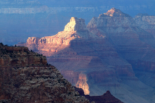 Views of the rock formations and shadows at Grand Canyon from South Rim in Arizona during sunset in the United States of America