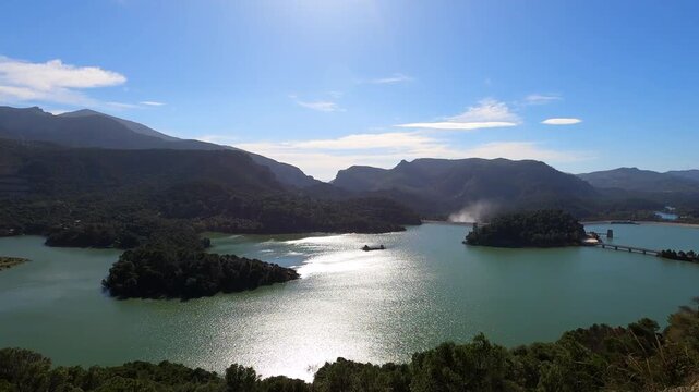 Scenic Guadalhorce reservoirs filled to the brim with water creating breathtaking natural landscape in Spain.