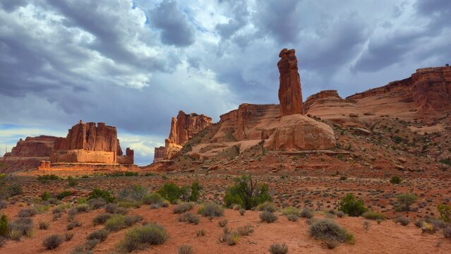 Exploring the rock formations and clouds of Arches National Park in Utah during the late afternoon