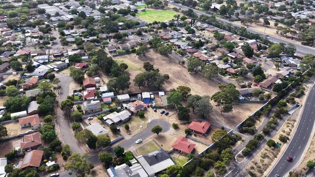 Hackham West, South Adelaide, South Australia: 4K aerial footage of residential suburb, houses, estates, streets, highways, traffic, urban infrastructure, near Noarlunga, Morphett Vale, Christie Downs